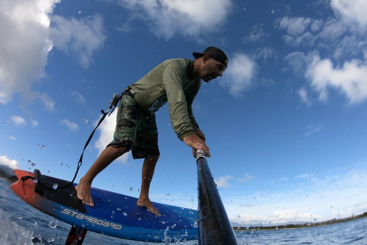 a man riding on the back of a boat